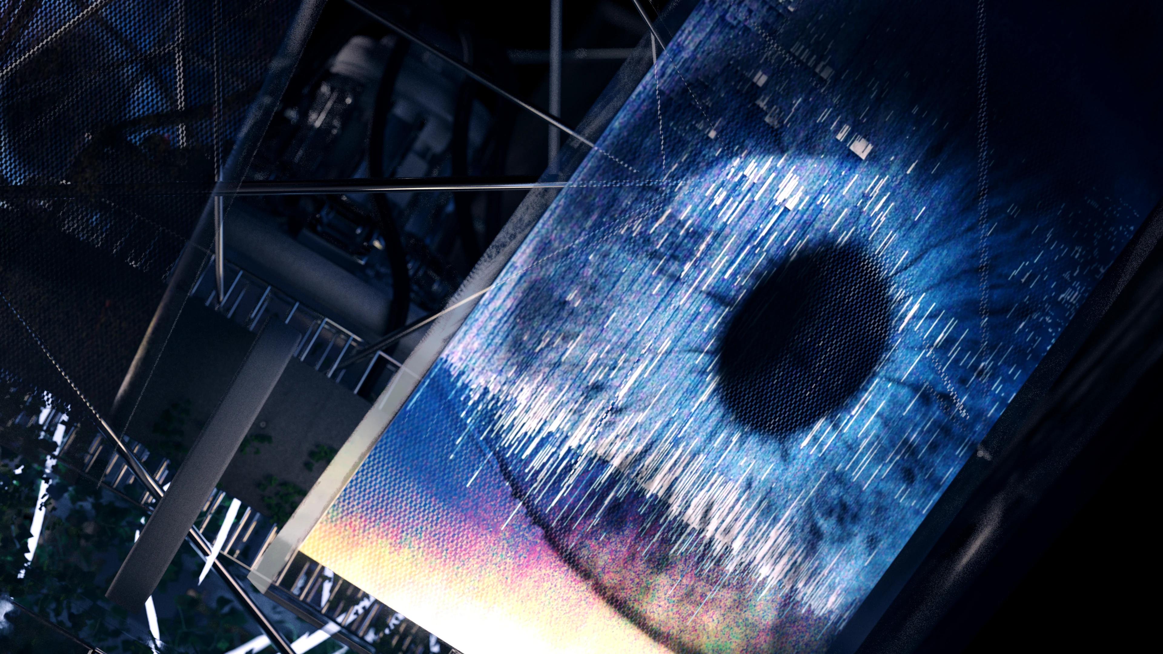 A macro eye displayed on a metal sheet surrounded by metal equipment