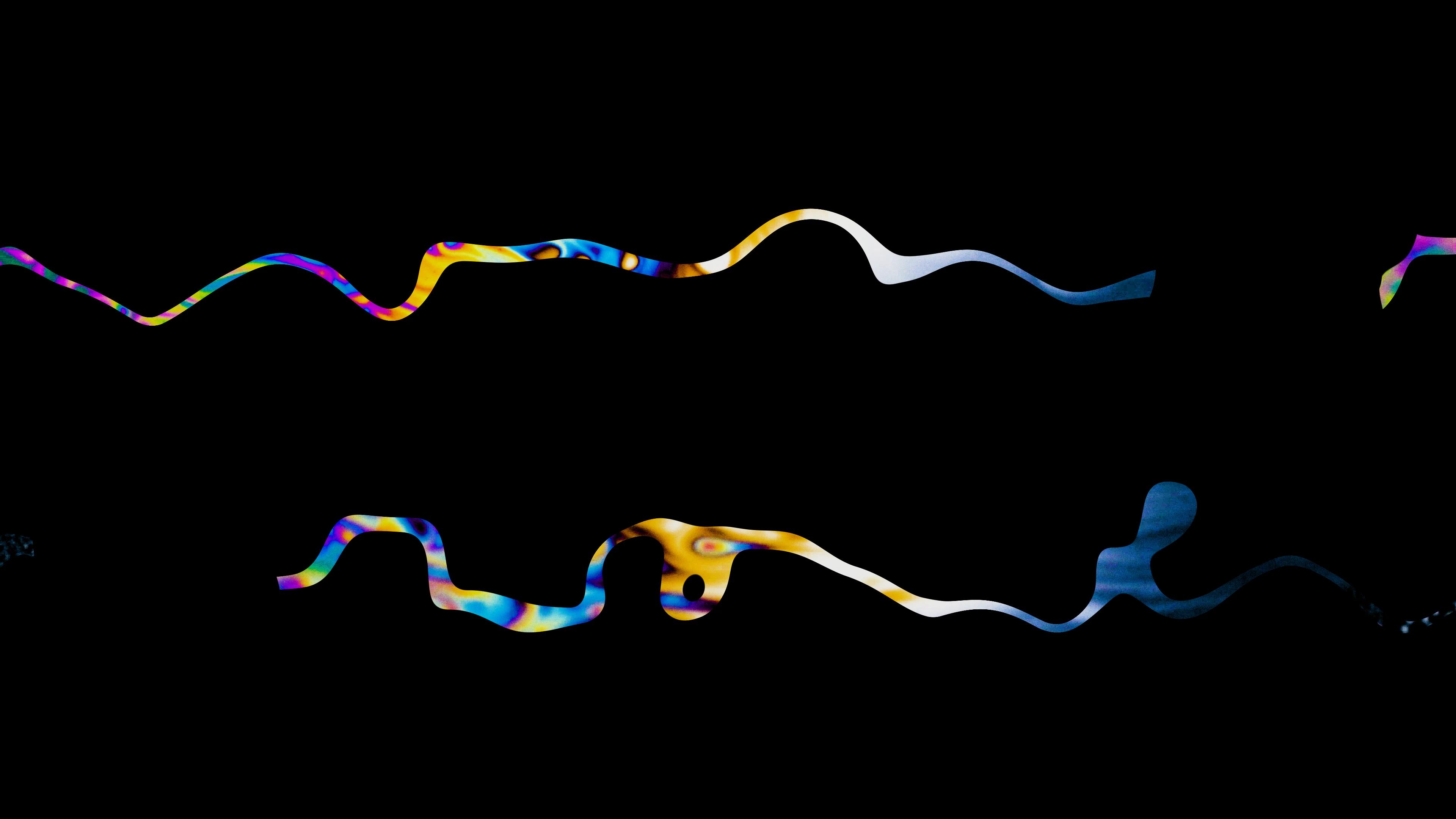 Mutlicoloured wiggly lines against a black background