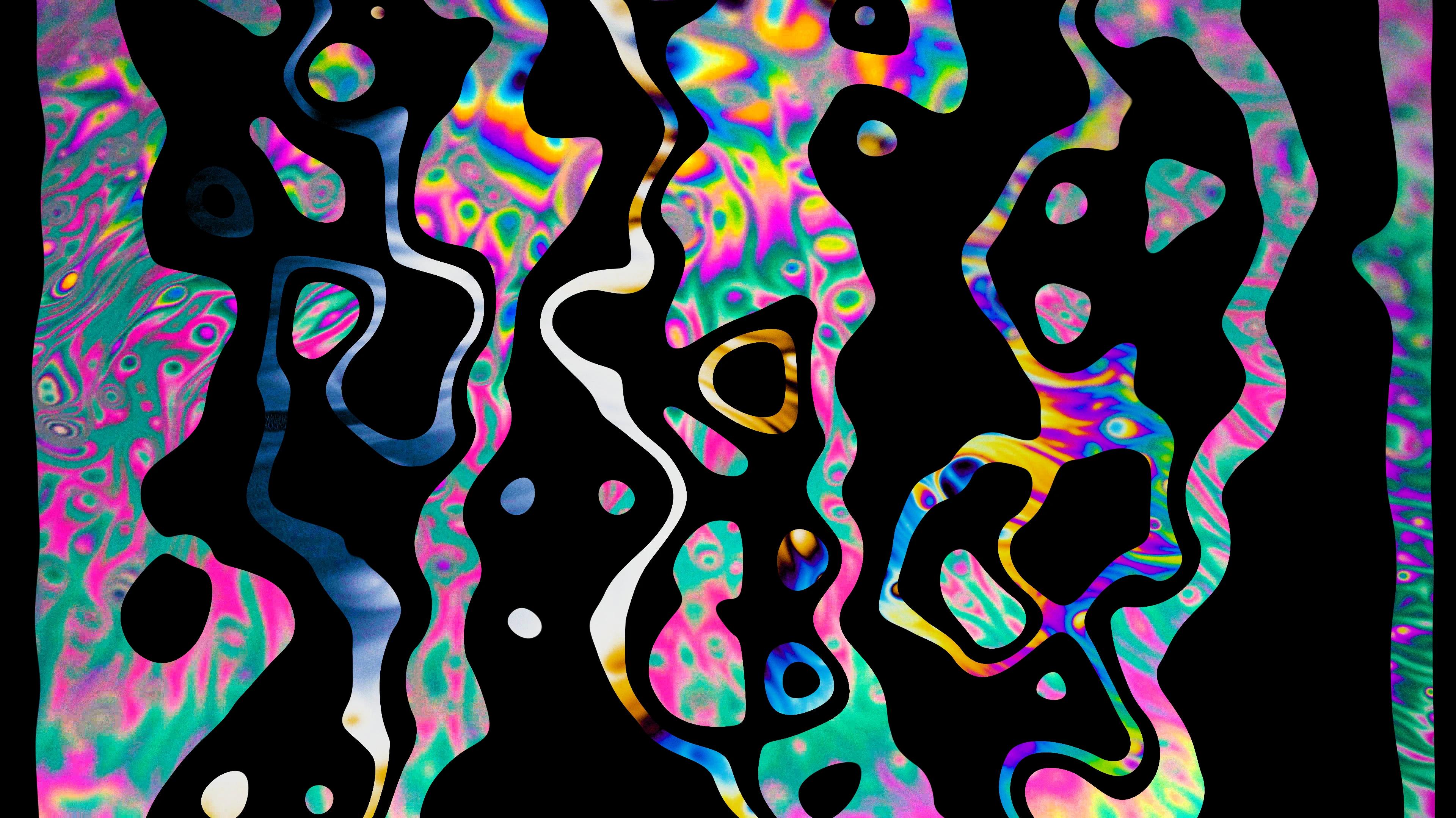 Multicoloured shapes in water with organic shape masks over the top