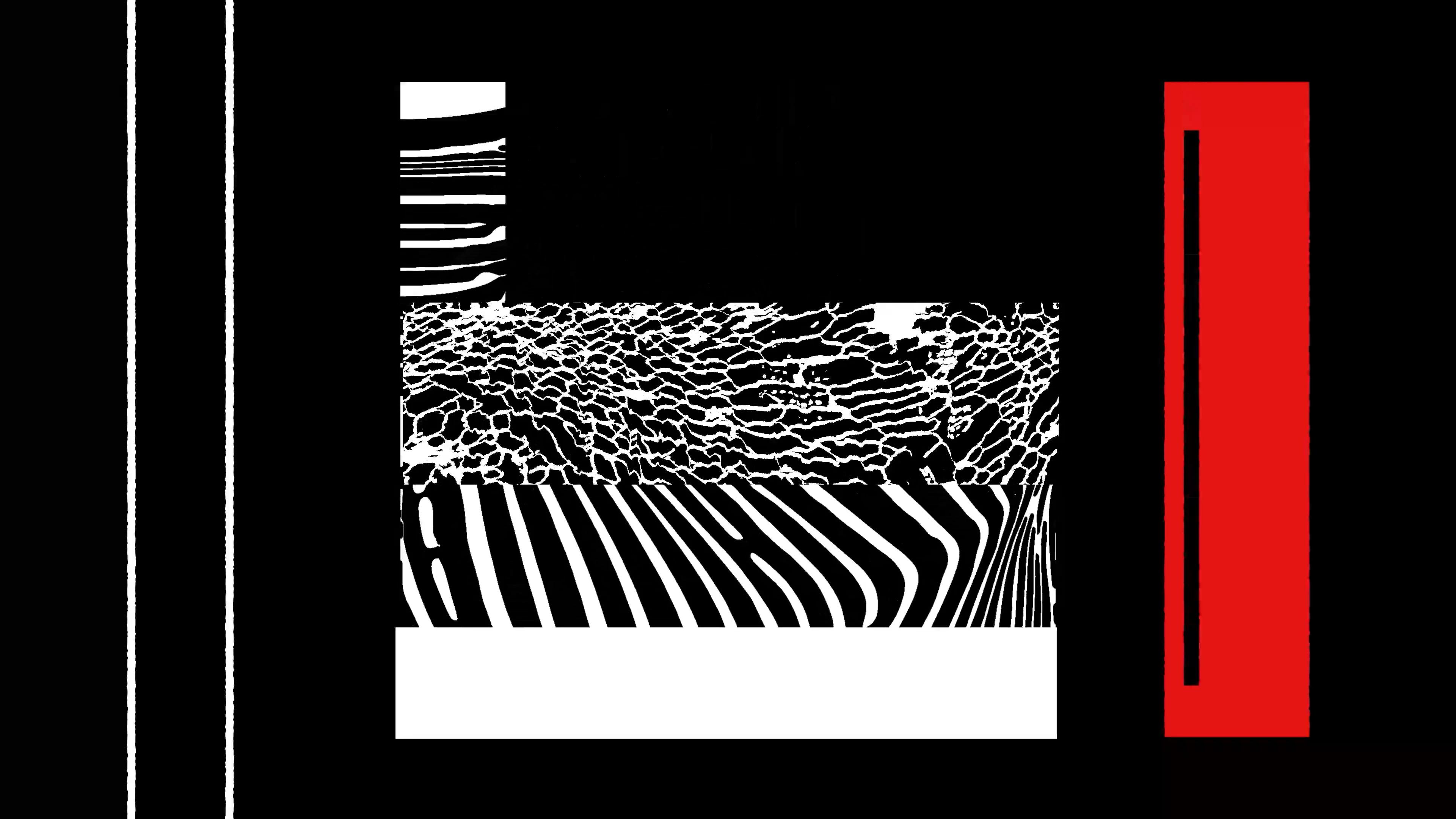 Geometric black, red and white shapes with stripes inside them