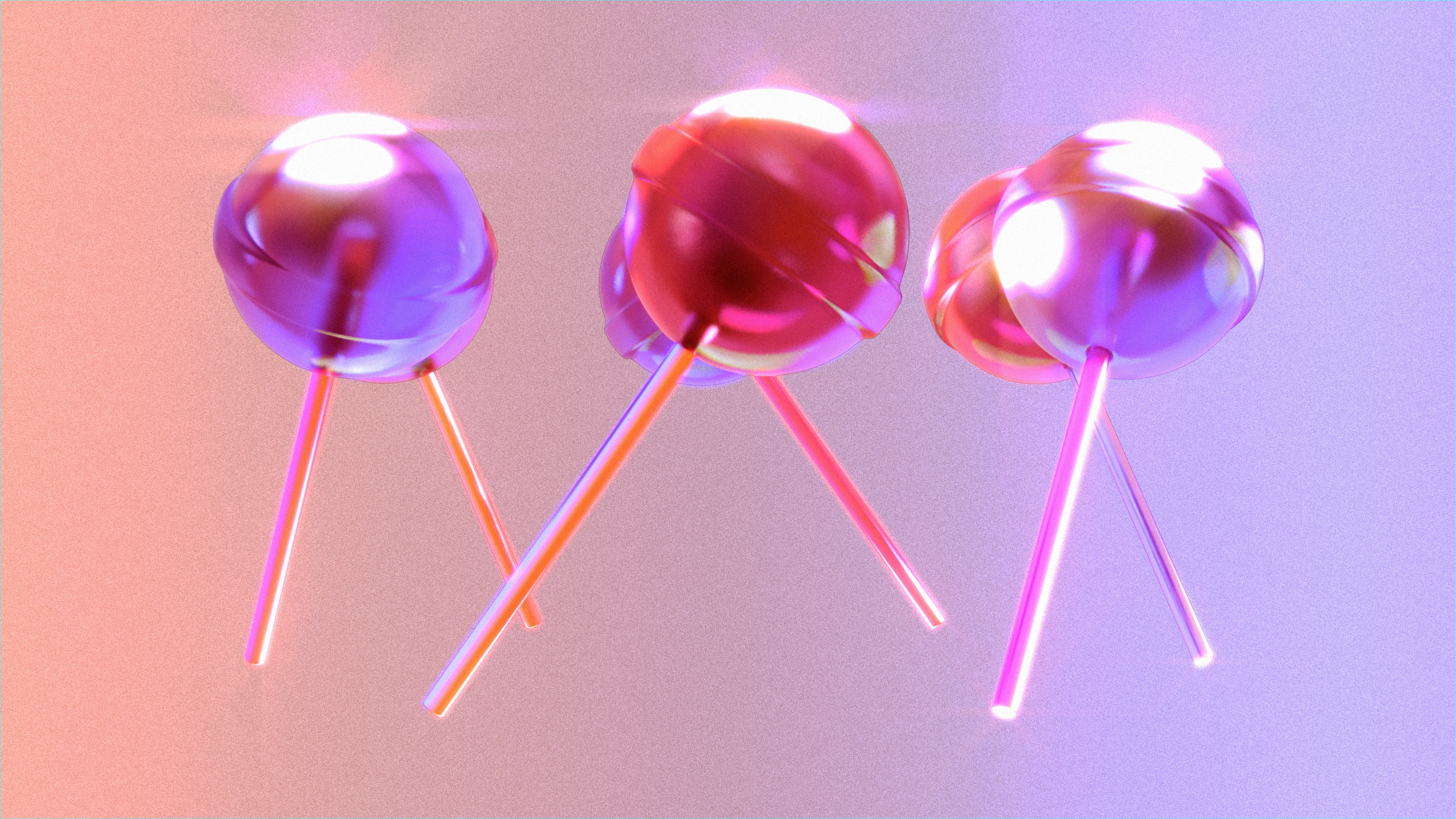 Shiny red and purple lollipops circling each other