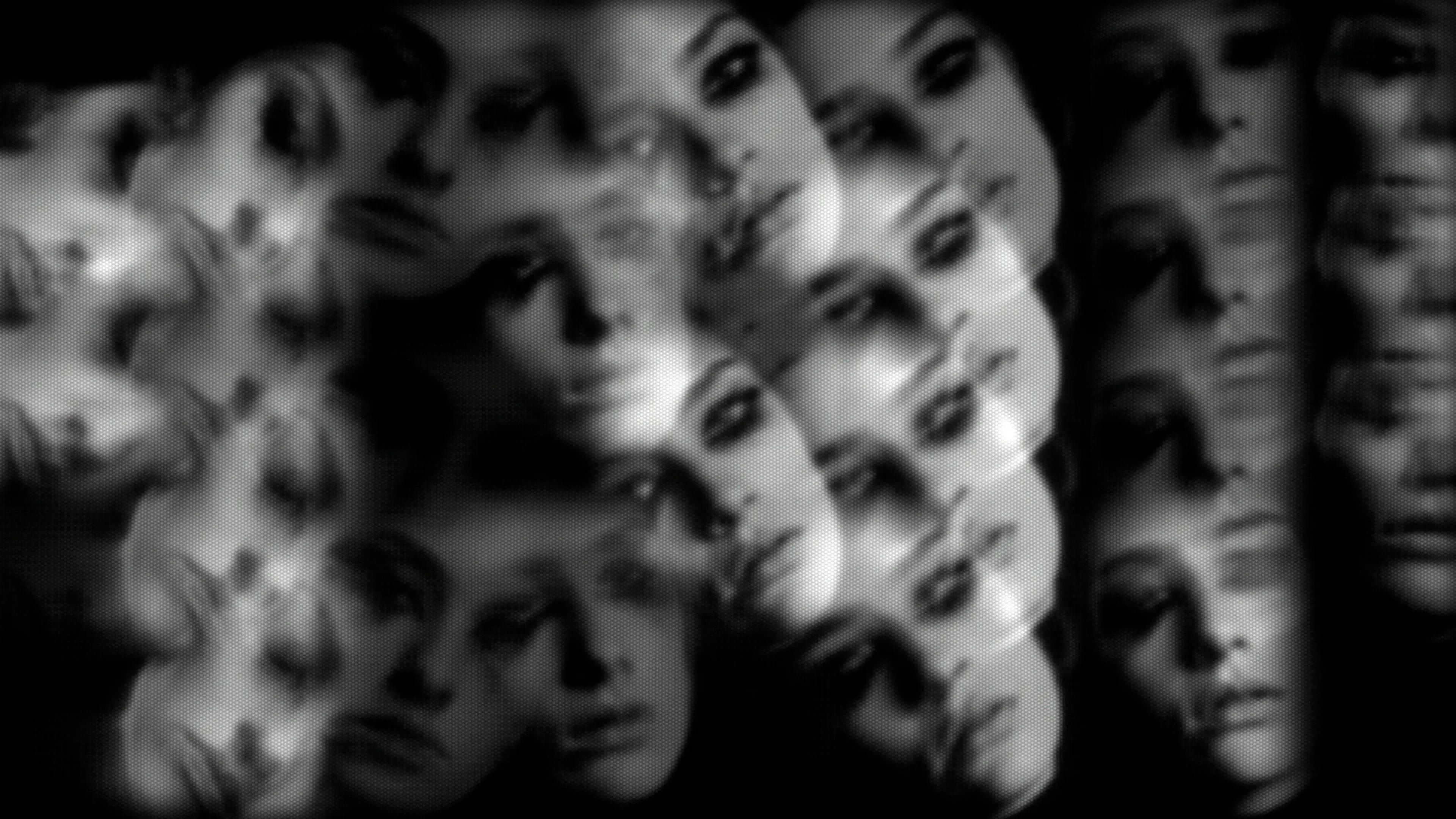 Blurry women's faces merging together