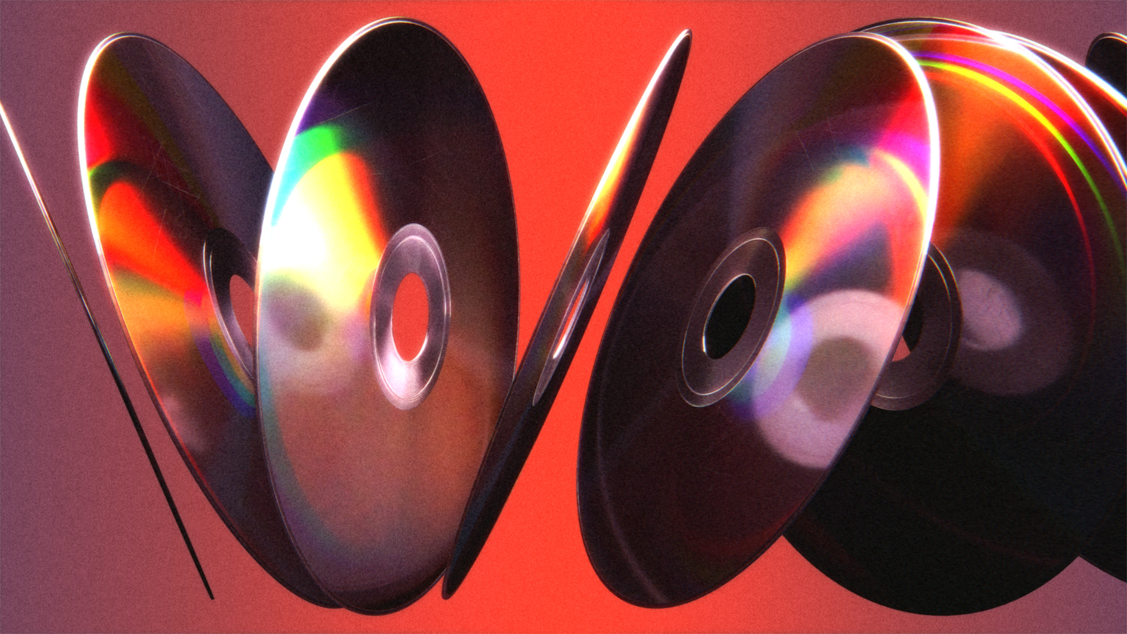 Row of CDs with rainbow reflections 