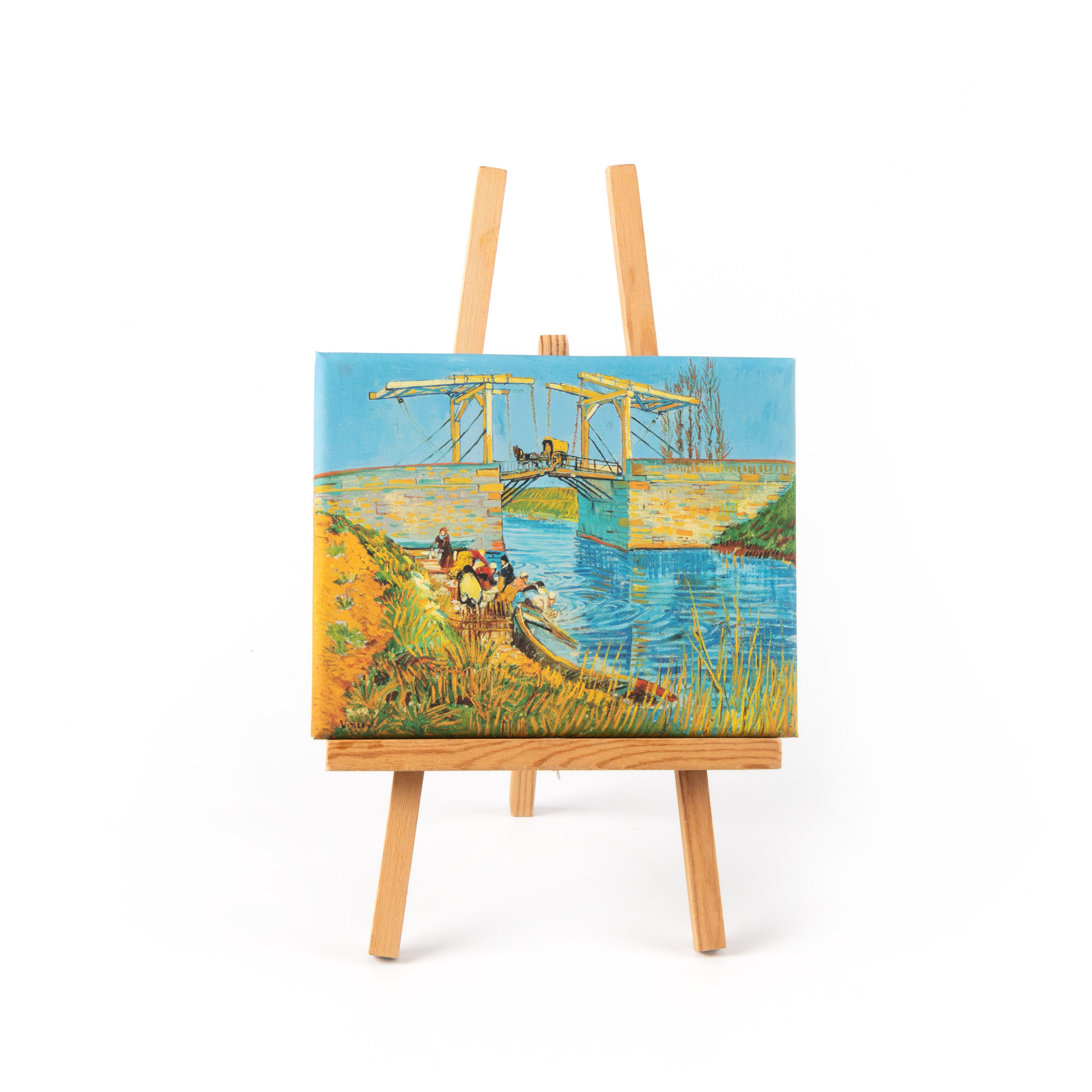 Een kleine schildersezel met daarop een miniatuur schilderij van Vincent van Gogh.