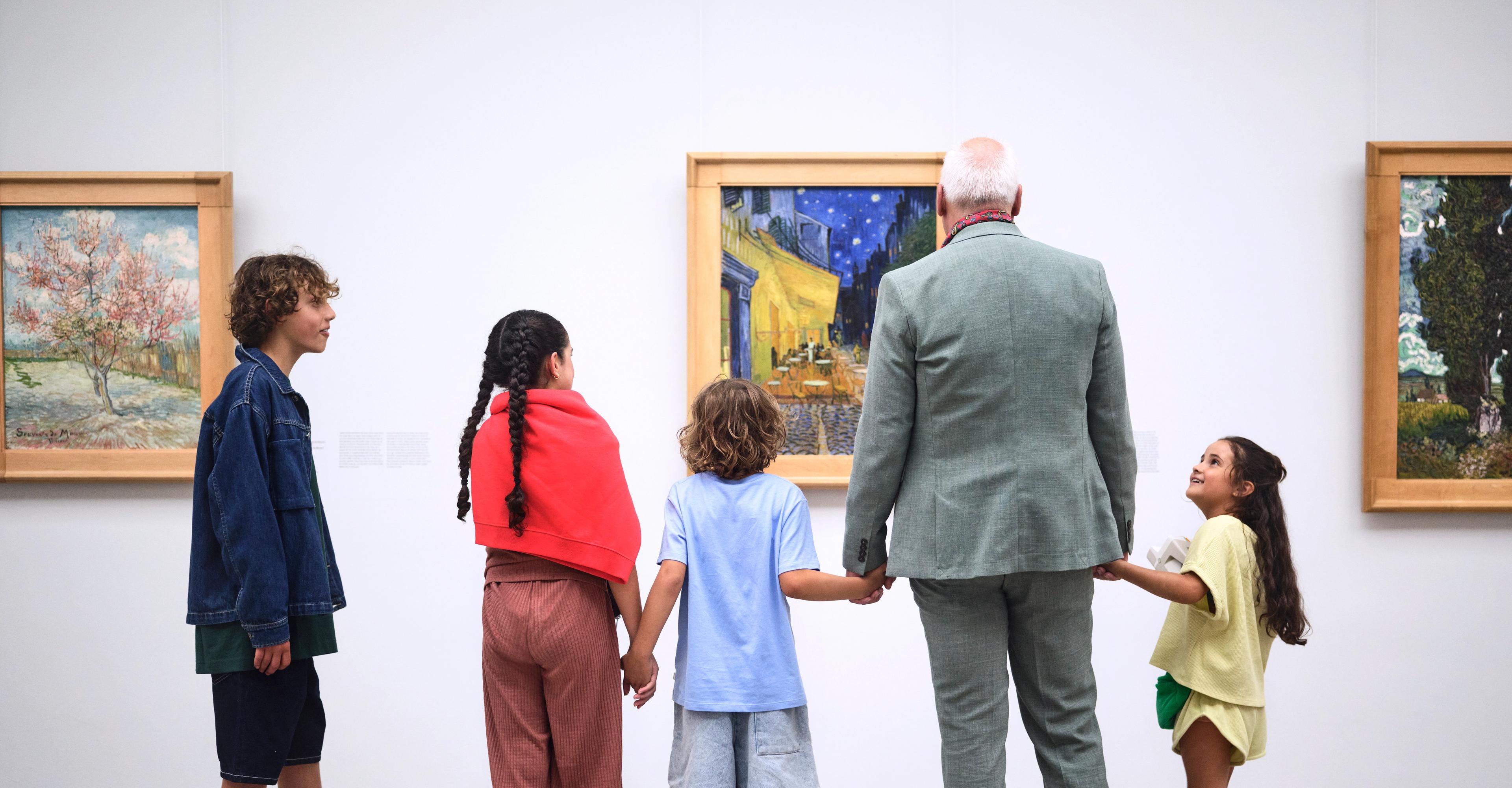 Family in the Van Gogh gallery, at 'Terrace of a Café at Night'