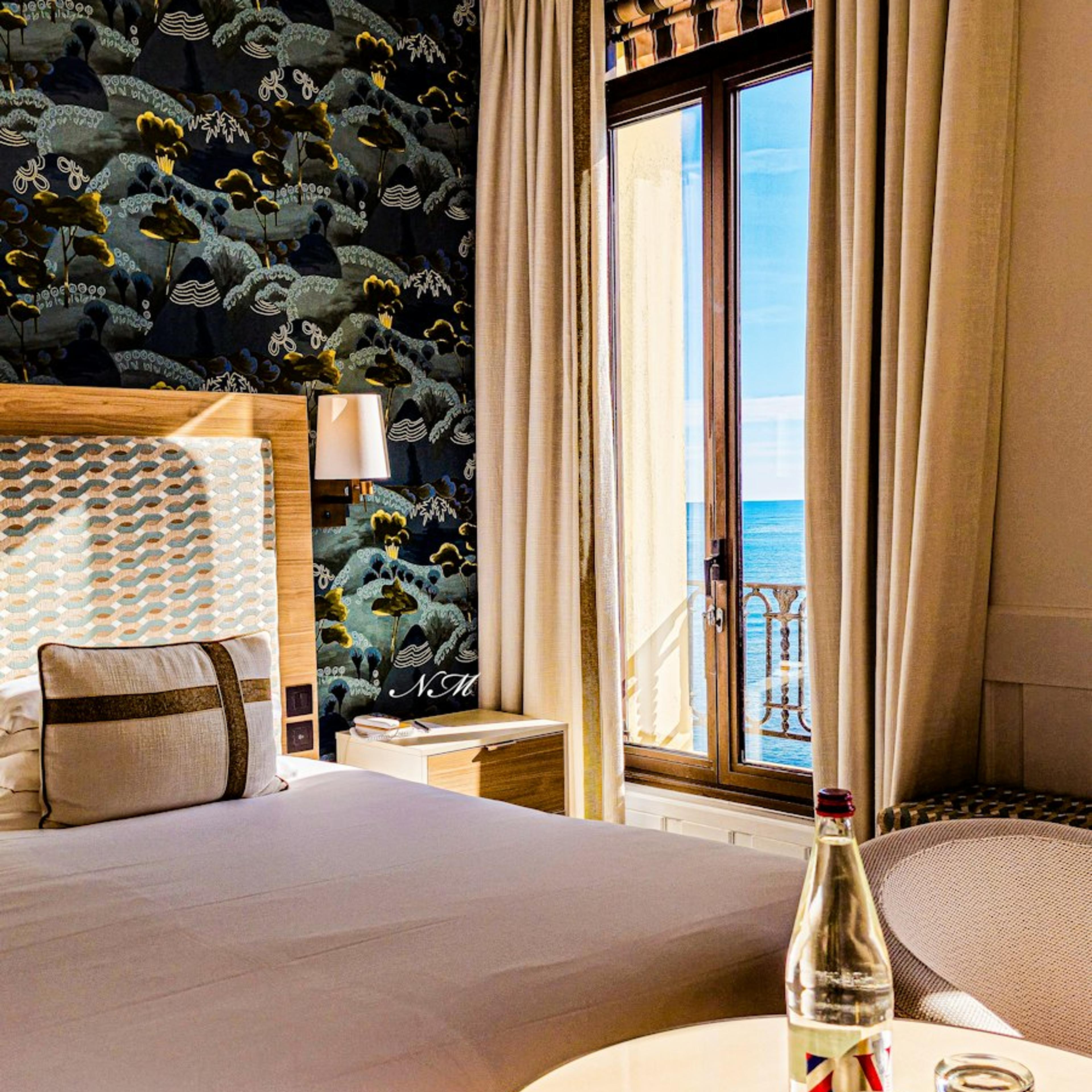 A bright hotel room with a large bed