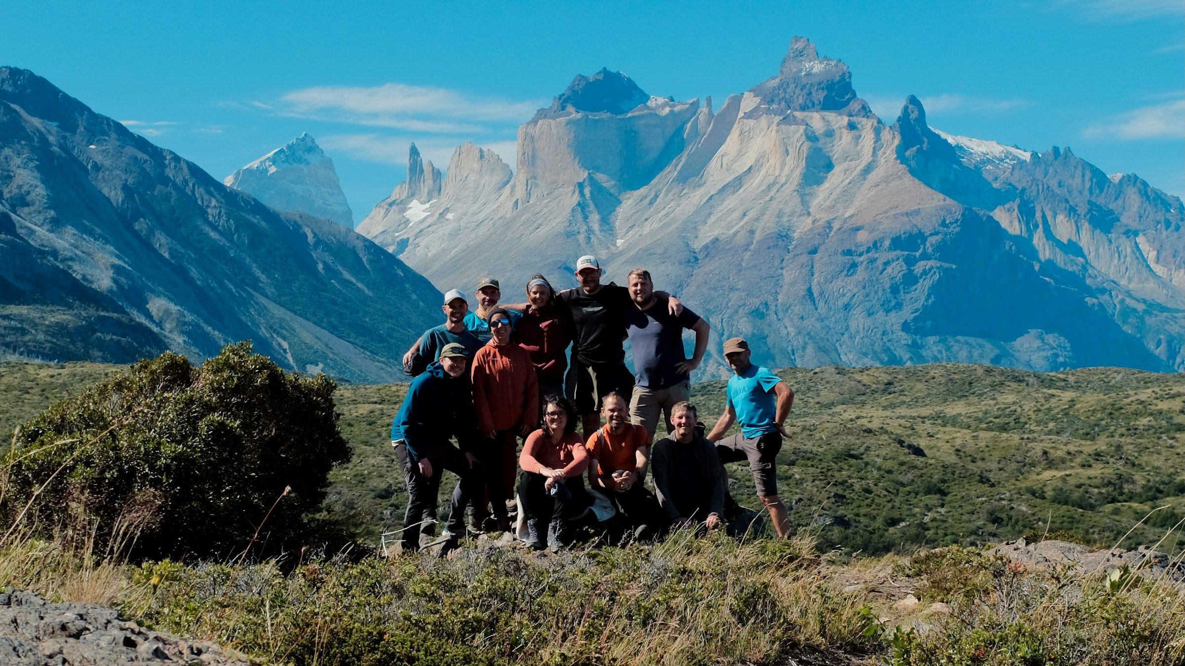 A group of hikers in front of mountains