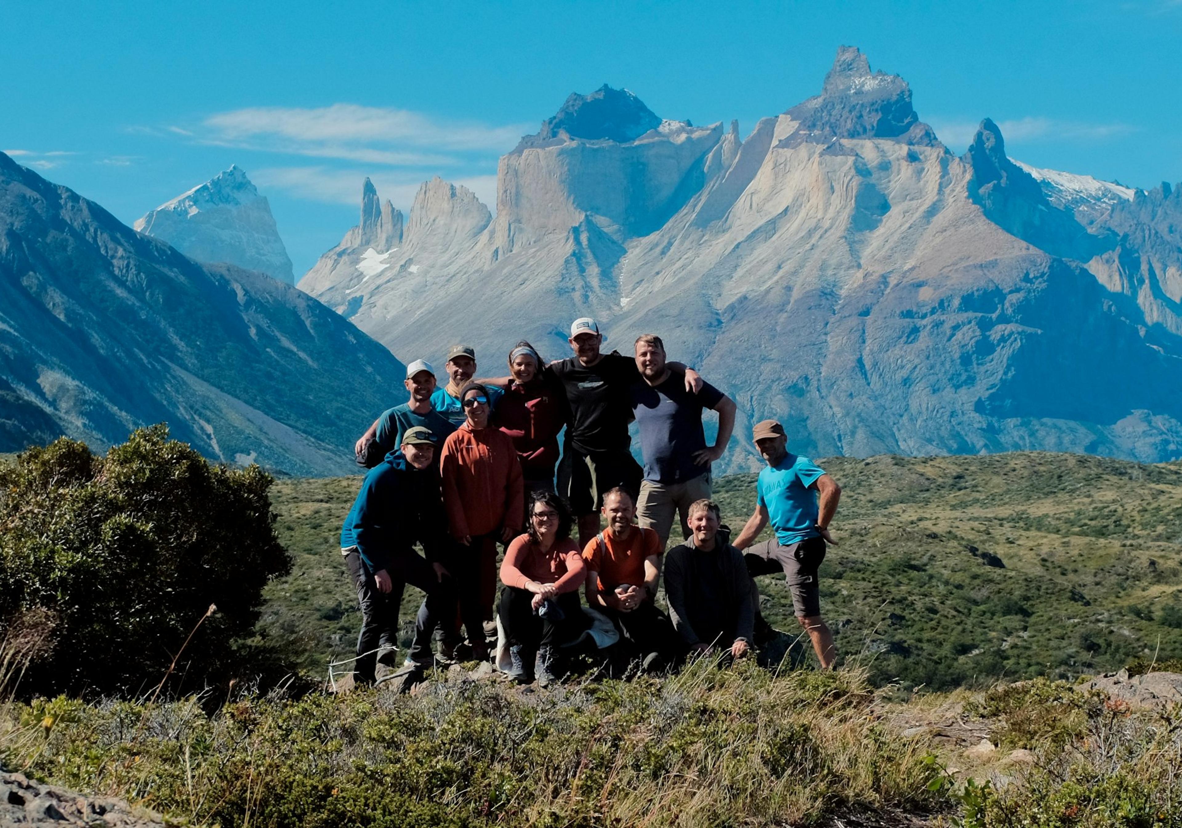 A group of hikers in front of mountains