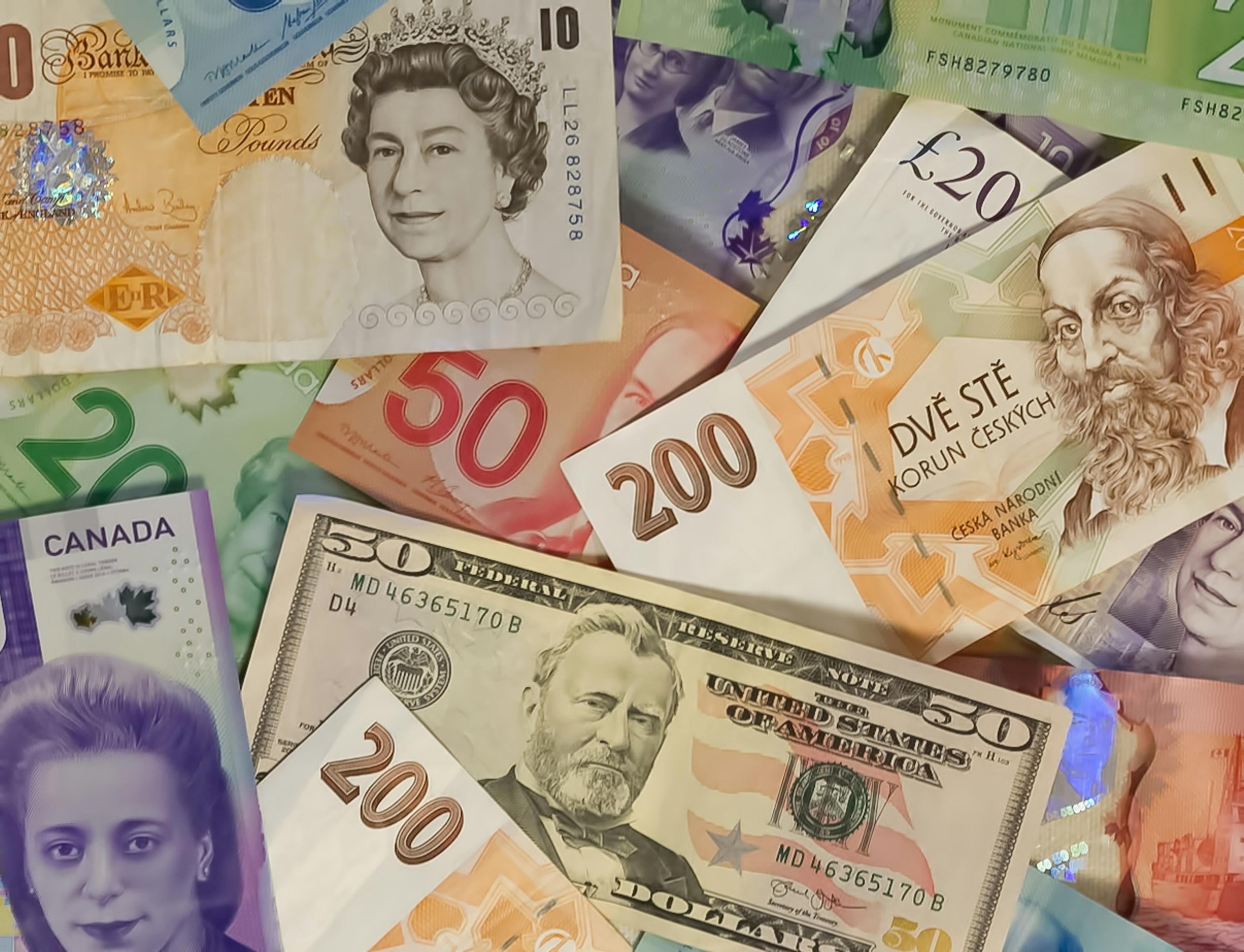 Banknotes from several countries, including Canadian bills