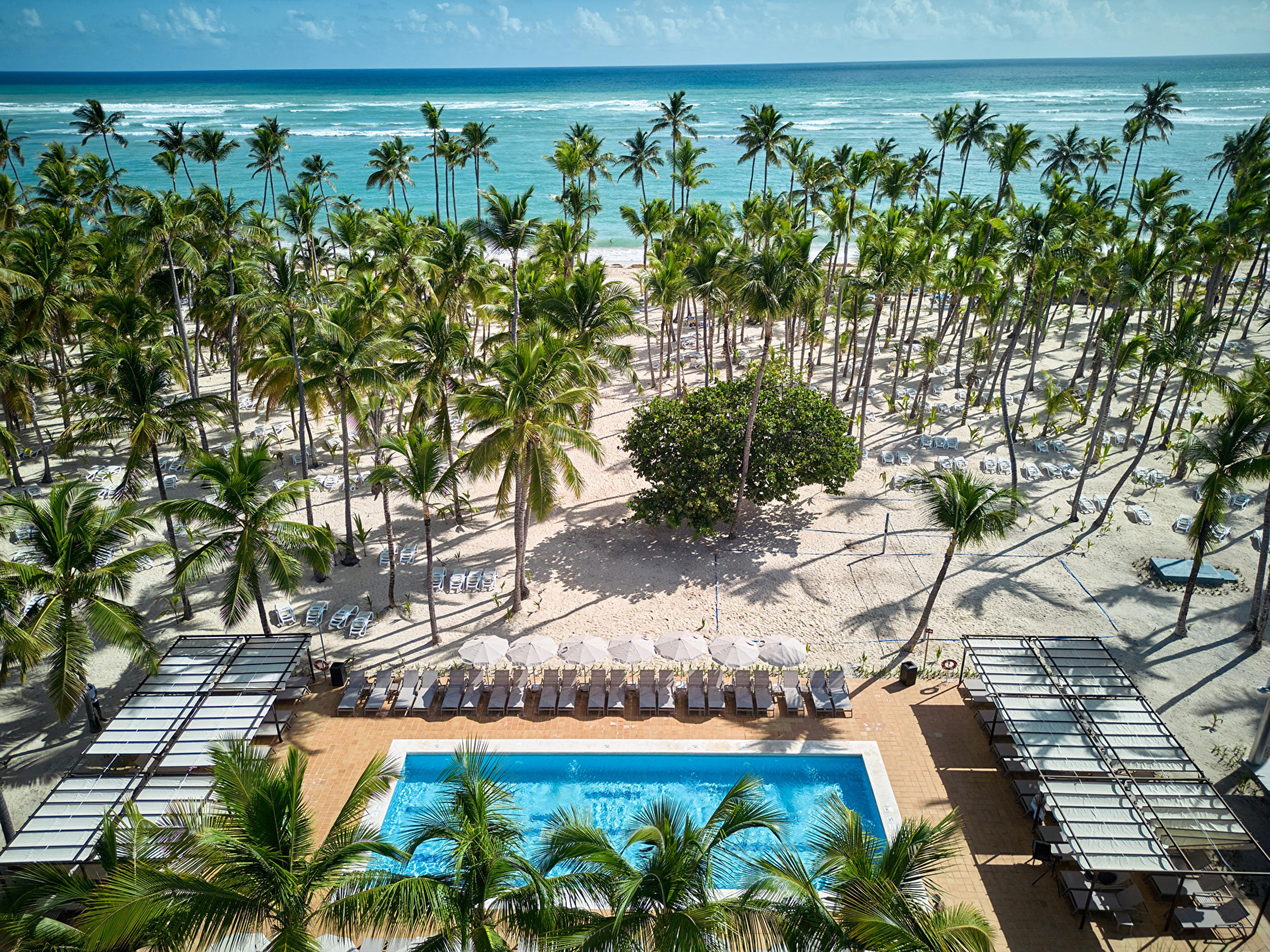 An aerial view of the pool and beach at the Riu Palace Macao