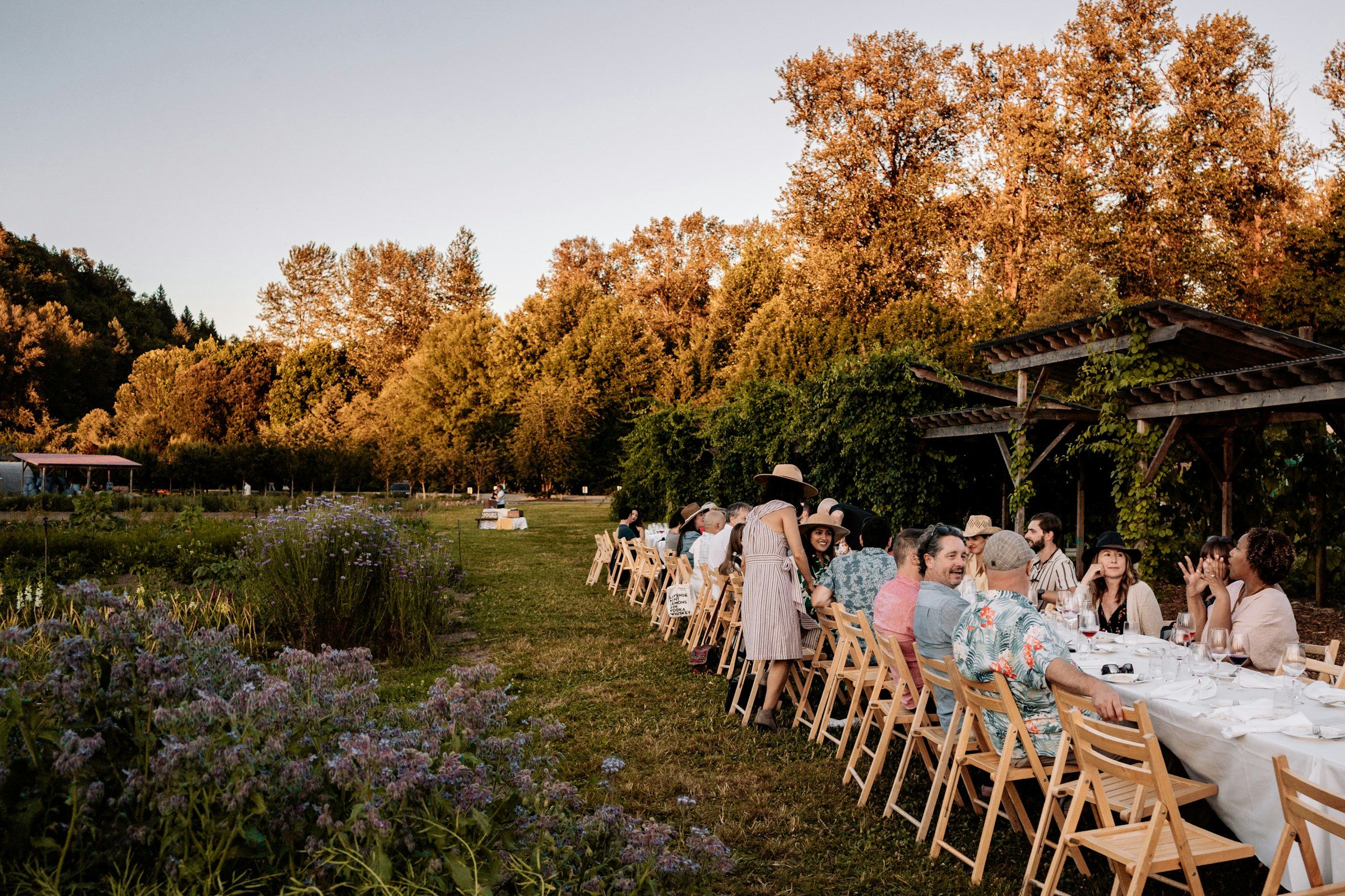 A large group seated around a long table