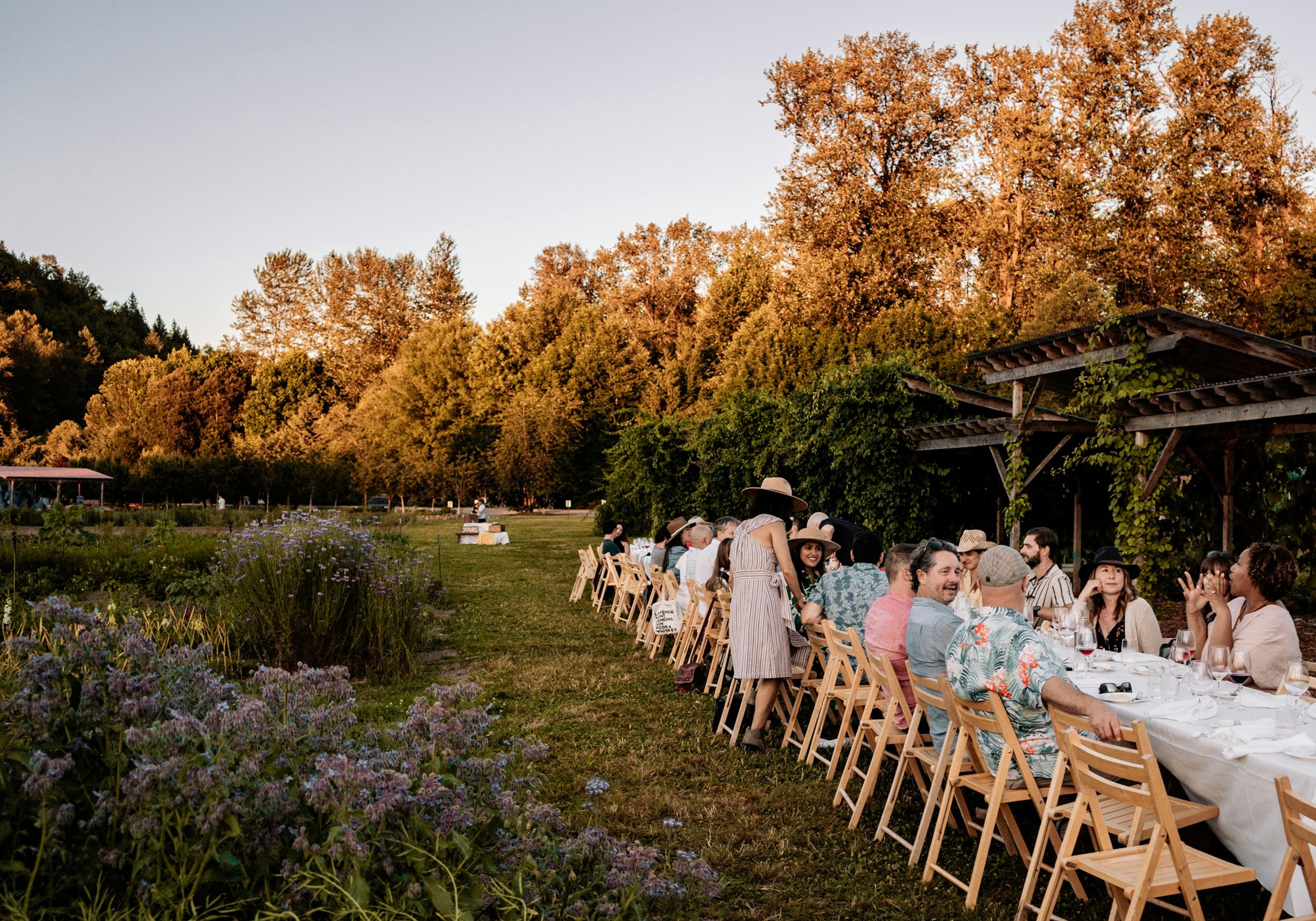 A large group seated around a long table