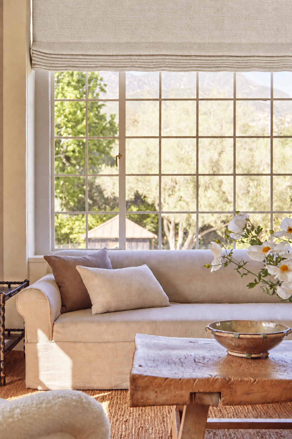 Desized solid linen Roman shade in an interior designed by Mike Moser
