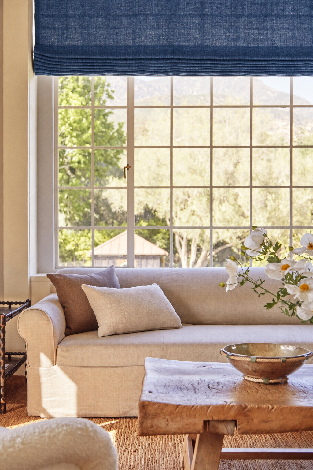 Indigo sheer linen Roman shade in an interior designed by Mike Moser