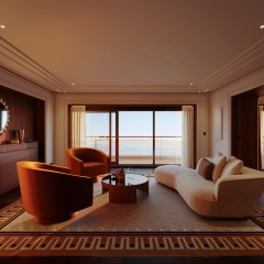 A private sitting room with warm timber, soft seating and views toward the horizon.