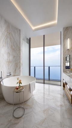Pale marble and a freestanding bath facing the sea.