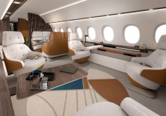 A lounge configuration with wide seats, tables and large windows.