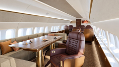 Dining and conference seating in a timber-and-leather cabin treatment.