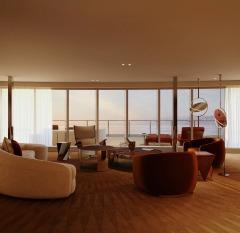 A sunlit lounge with curved seating, warm floors and panoramic glazing.