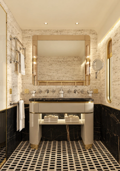 A marble bathroom with twin basins, warm lighting and a geometric floor.