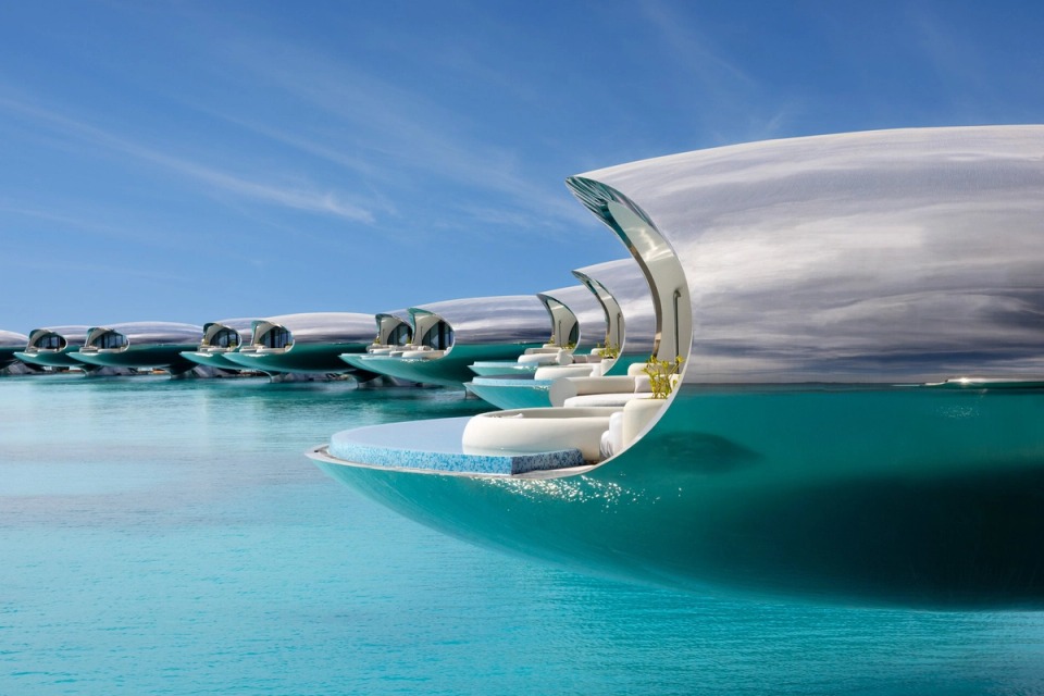 Shebara’s reflective overwater villas above the lagoon.