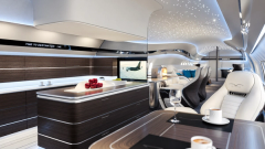 A contemporary BBJ lounge concept with sculptural seating and ceiling lighting.