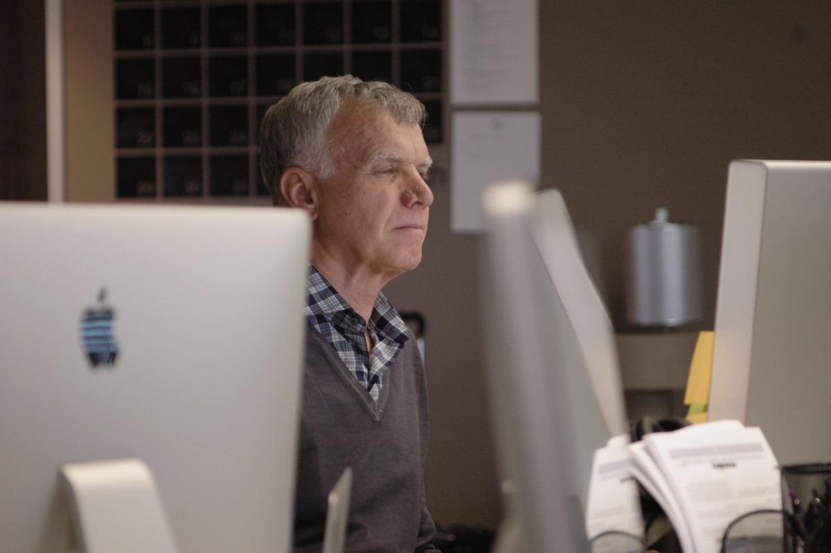 Tim Gill working at his computer