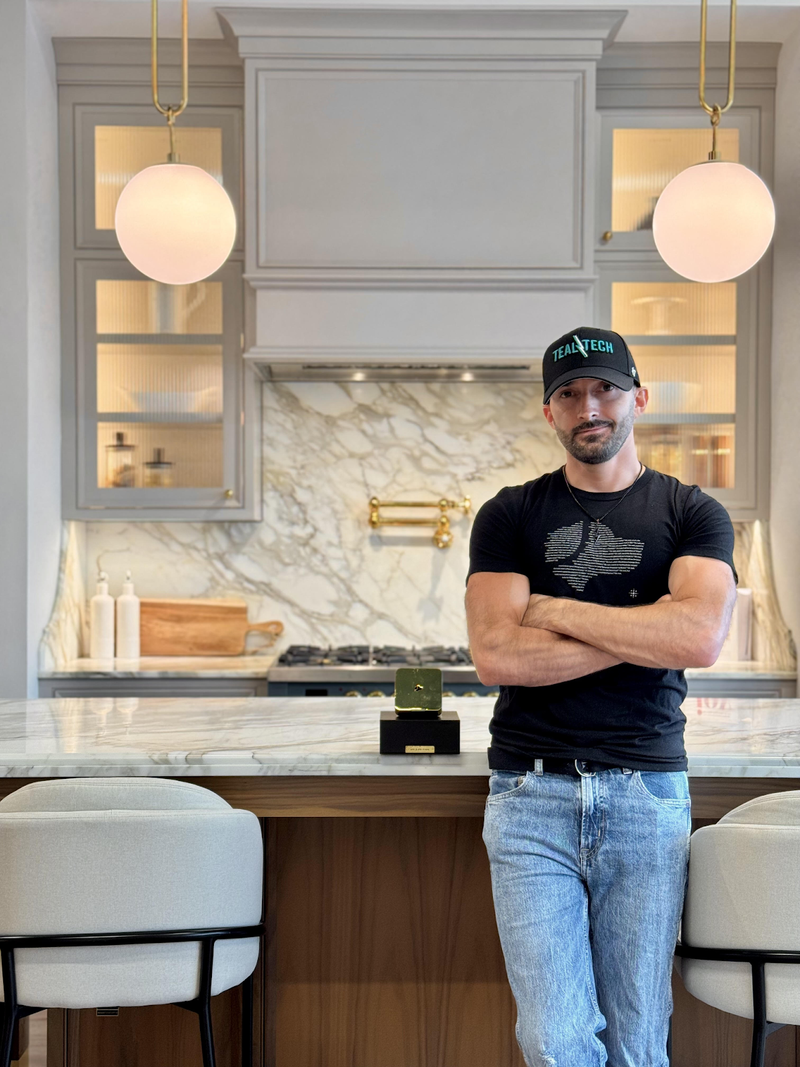 Teal Tech employee posing with Gold Josh One.