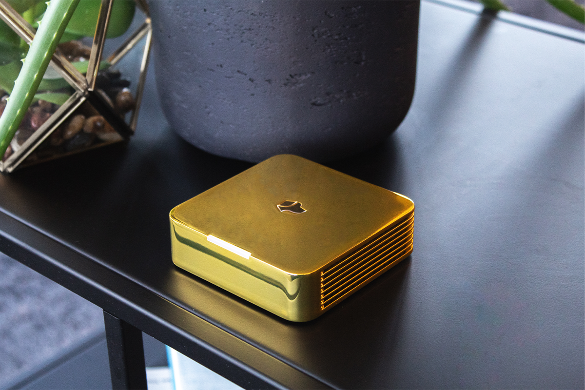 Gold Josh One displayed prominently on a modern table.