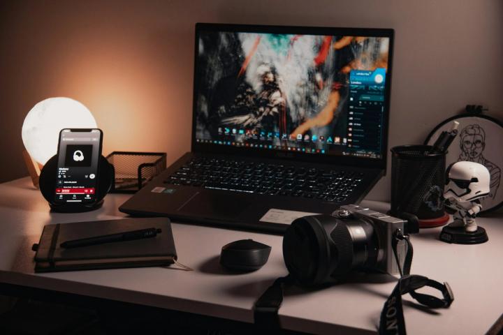 a laptop computer sitting on top of a desk
