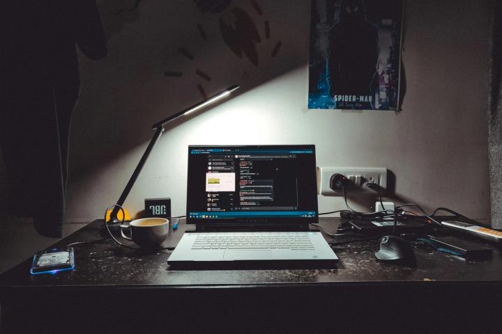 macbook pro on black table