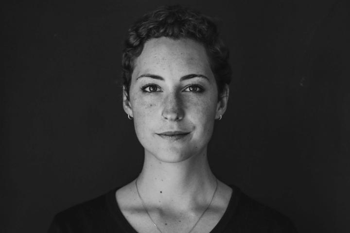 grayscale photo of woman wearing necklace and top