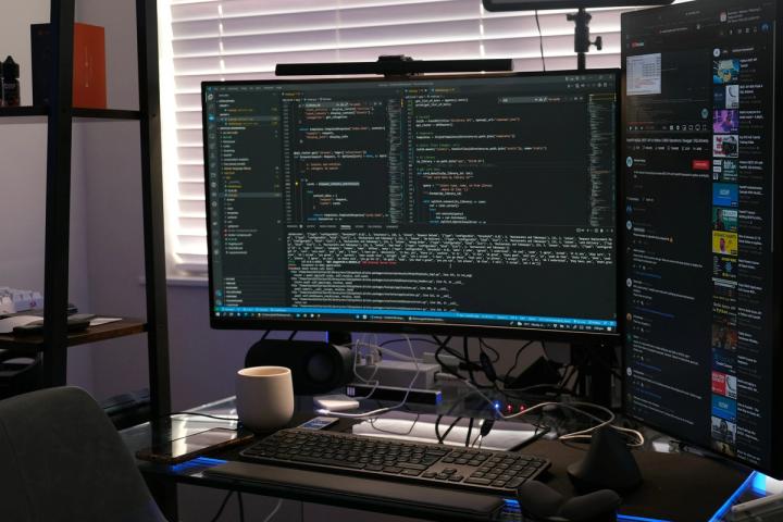 a computer monitor sitting on top of a desk