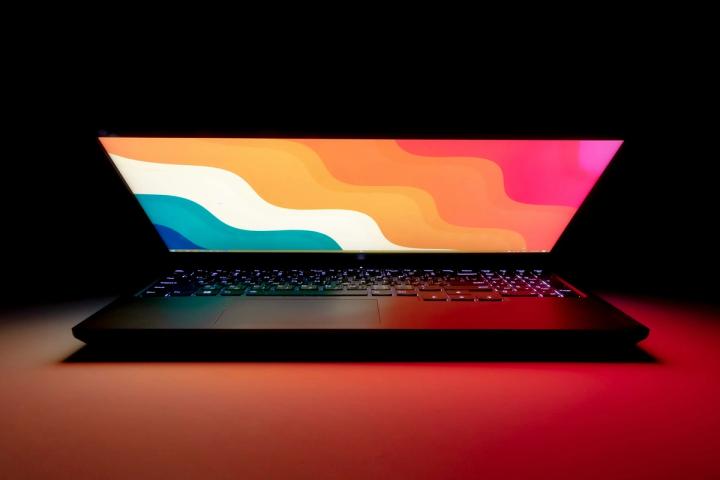 macbook pro on black table