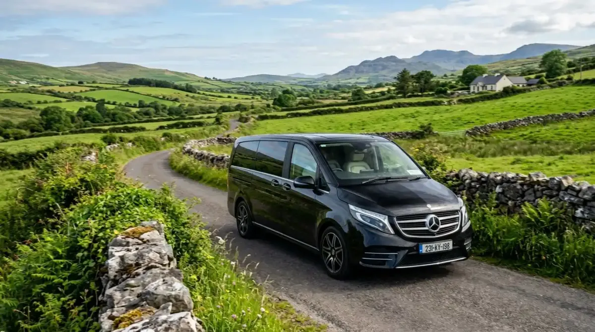 An elite private chauffeur vehicle transporting luxury travelers and golf gear smoothly through the Irish countryside.