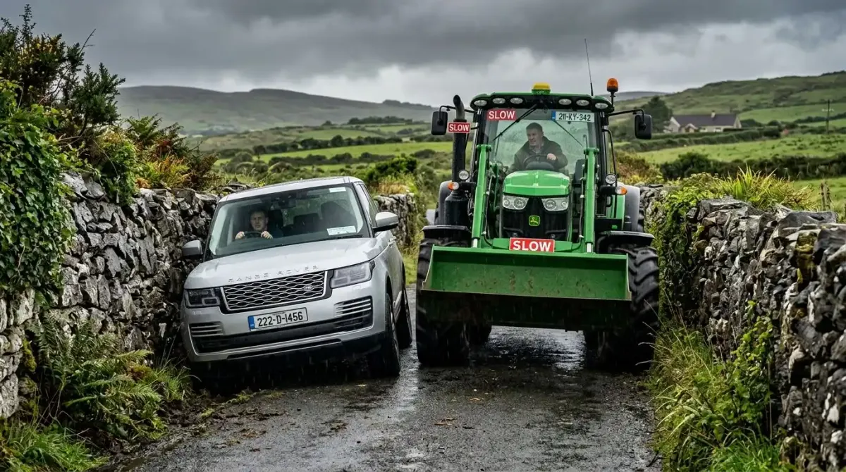 The stress of driving a luxury rental car on a narrow, stone-walled Irish road with oncoming farm traffic.