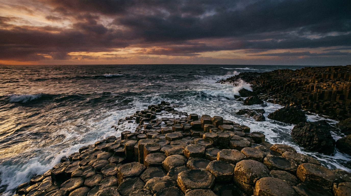 Dramatic sunset over the hexagonal basalt columns of the Giant's Causeway in Northern Ireland.