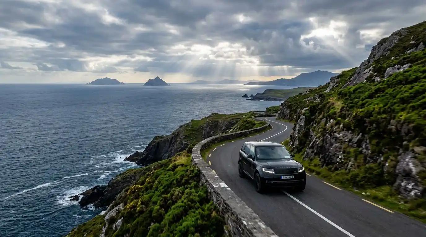 A luxury SUV navigating the scenic coastal roads of the Ring of Kerry with the Skellig Islands in the background.