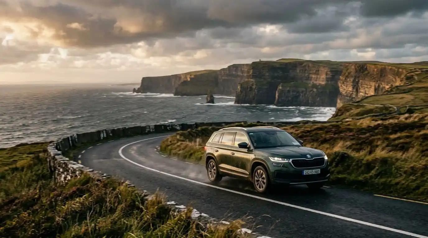 A luxury SUV navigating a scenic coastal road during an all inclusive Ireland vacation.