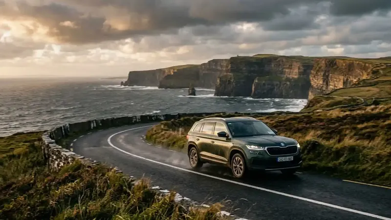 A luxury SUV navigating a scenic coastal road during an all inclusive Ireland vacation.