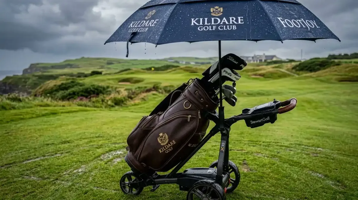 Premium technical rain gear protecting a high-end golf bag on a stormy day along the Irish coast.