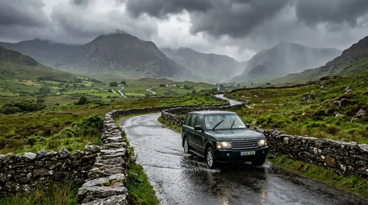 A high-end SUV safely navigating winter road conditions in rural Ireland.