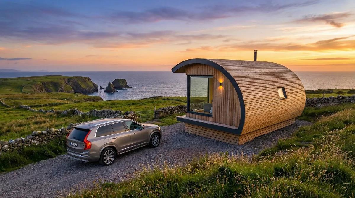 Luxury glamping pod overlooking the Irish coast with a rental car parked