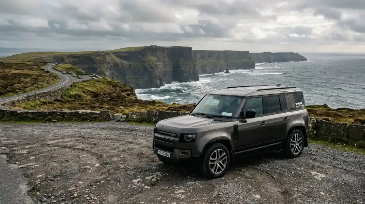 A premium automatic SUV parked at a scenic coastal overlook during a self-drive honeymoon package in Ireland.