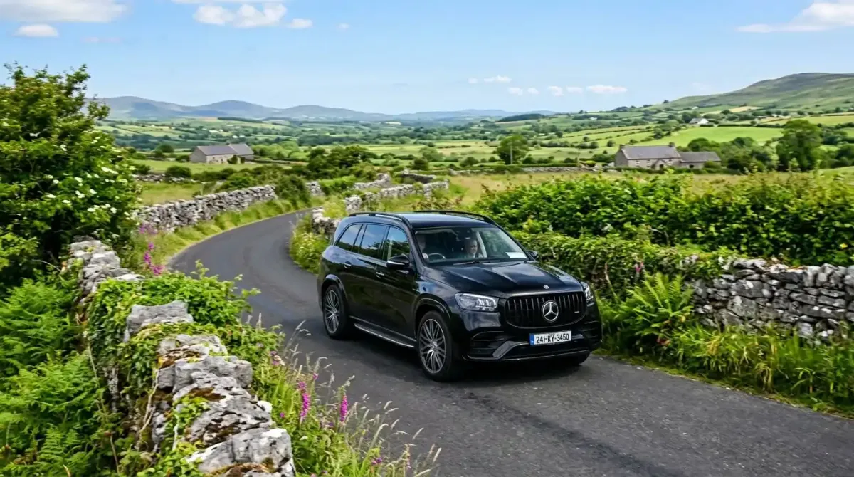 A premium luxury automatic transport vehicle handling the narrow rural roads of the Irish countryside with ease.