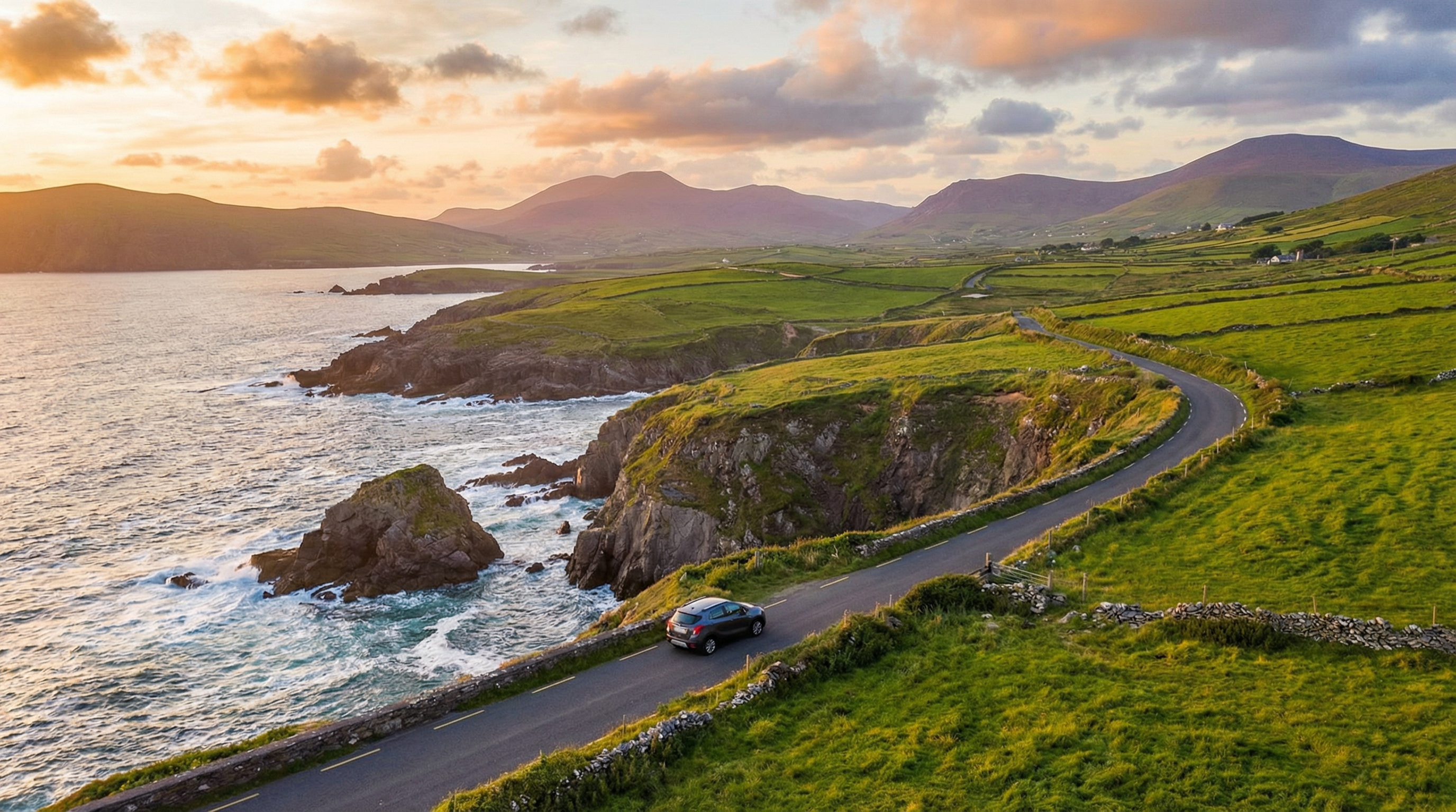 Modern rental car on a scenic coastal road in County Kerry, Ireland