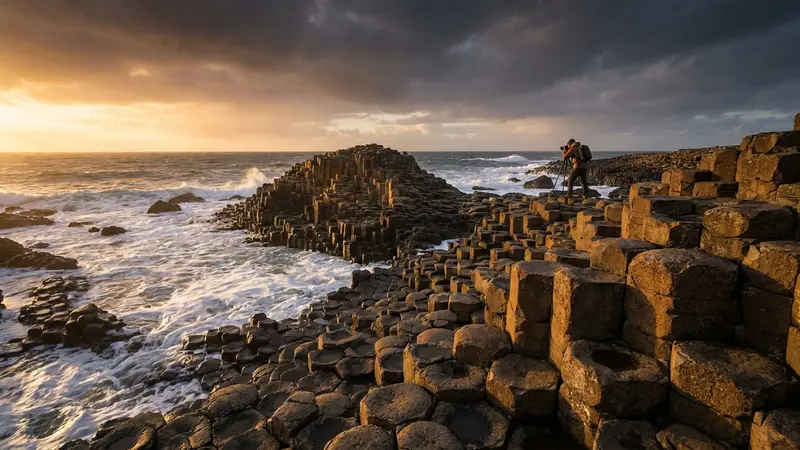 Sunrise over the iconic hexagonal basalt columns of the Giant's Causeway in Northern Ireland.