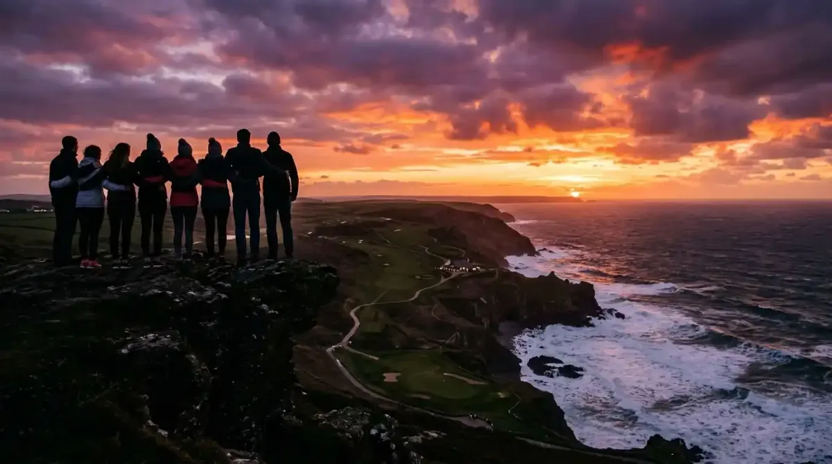 A private golf syndicate sharing an unforgettable milestone sunset moment on a true Irish links course.