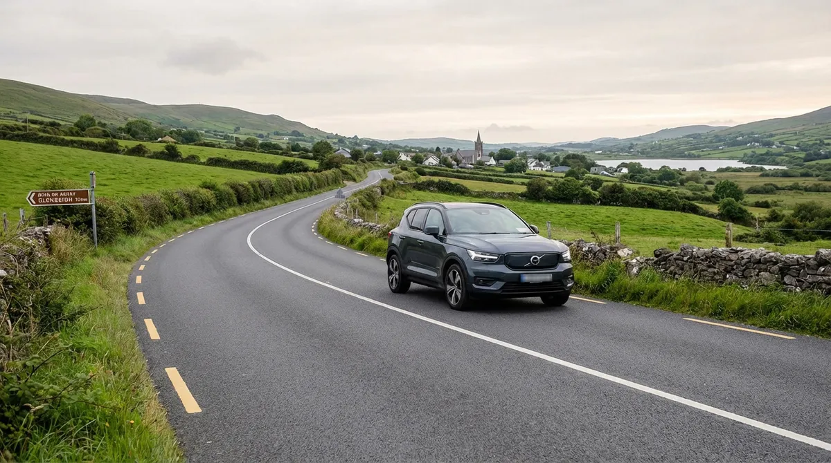 Modern compact SUV driving on a regional Irish road with a couple enjoying the view