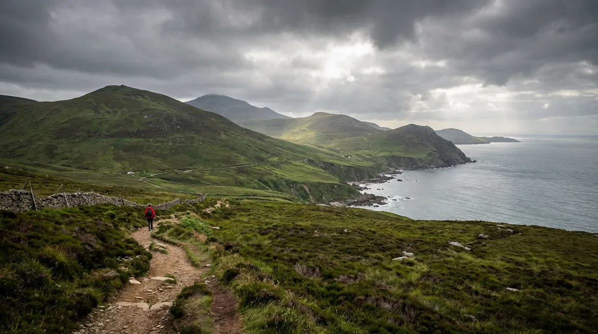 Panoramic view of the rolling green Mourne Mountains sweeping down to the sea in Northern Ireland.